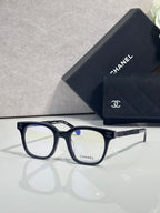 Navy square eyeglasses with gold CHANEL logo temple detail