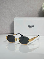 Celine octagonal sunglasses with gold frame, dark lenses, and black temple accents