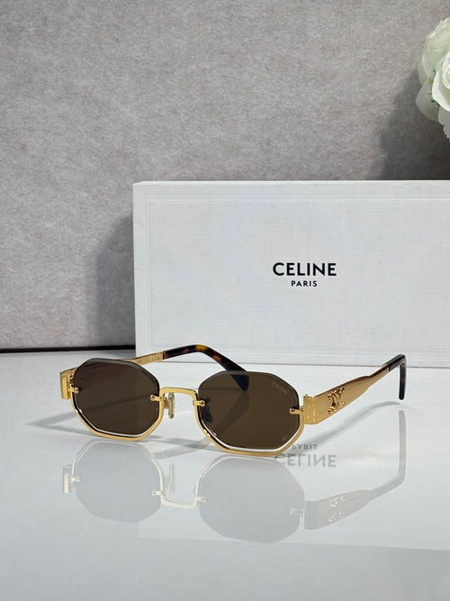 Celine octagonal sunglasses with gold frame, dark lenses, and blue temple accents