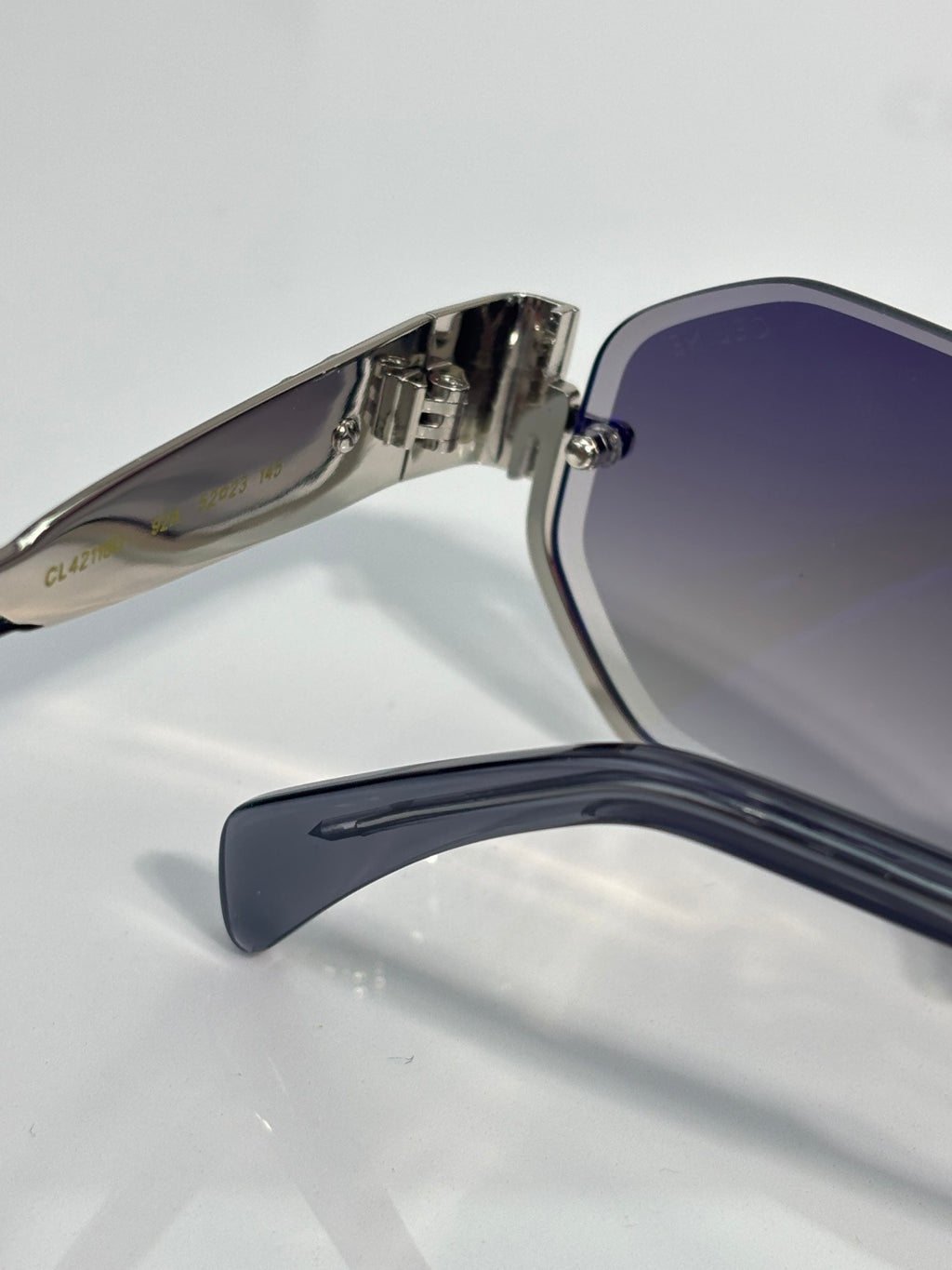 Celine sunglasses side view with dark blue temple and silver metal hinge