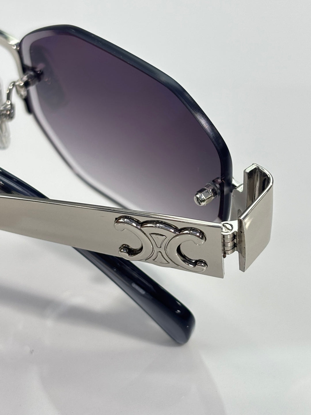 Celine glasses close-up of side logo detail and dark lenses