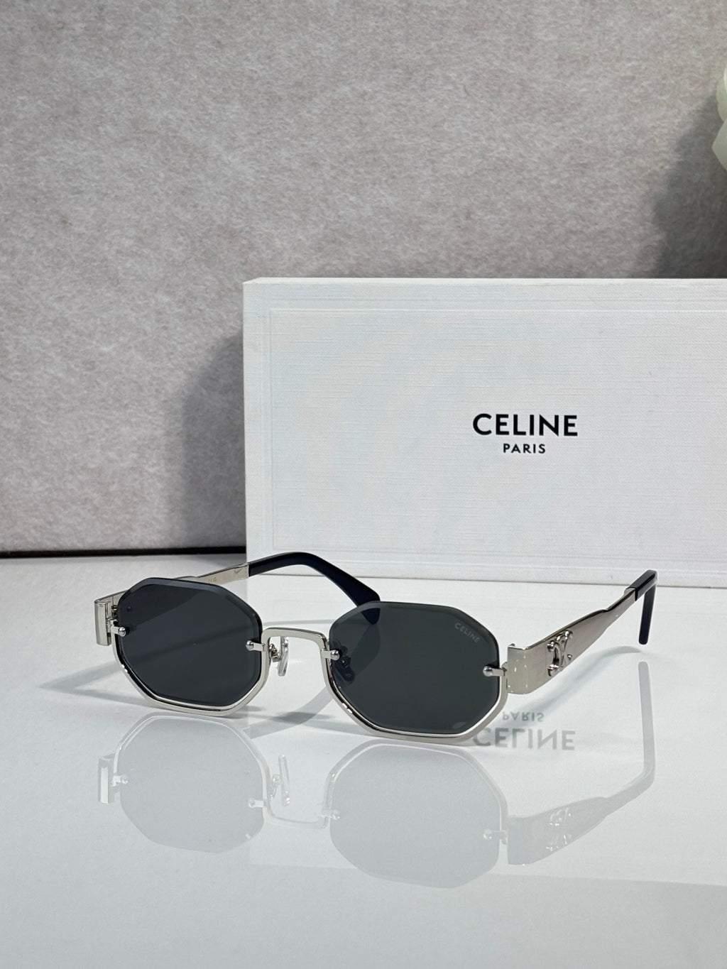 Celine glasses with dark frame and oval black-tinted lenses