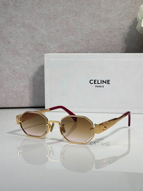 Celine glasses with gold-tone frame and burgundy temple, dark tinted lenses