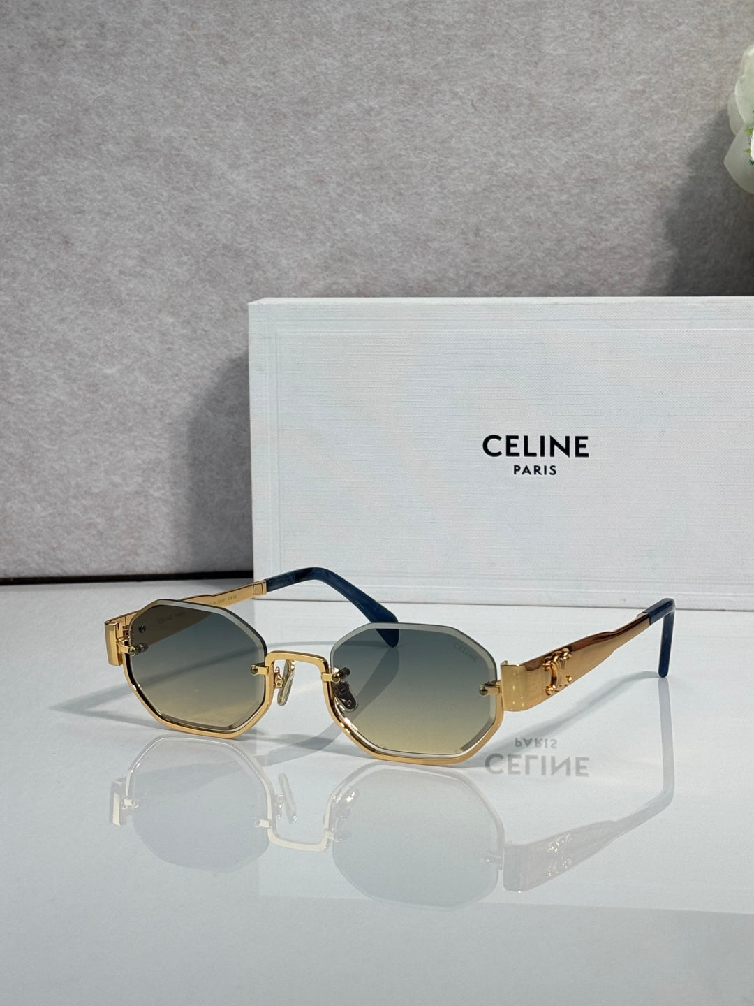 Celine glasses with gold-tone frame and dark tinted octagonal lenses