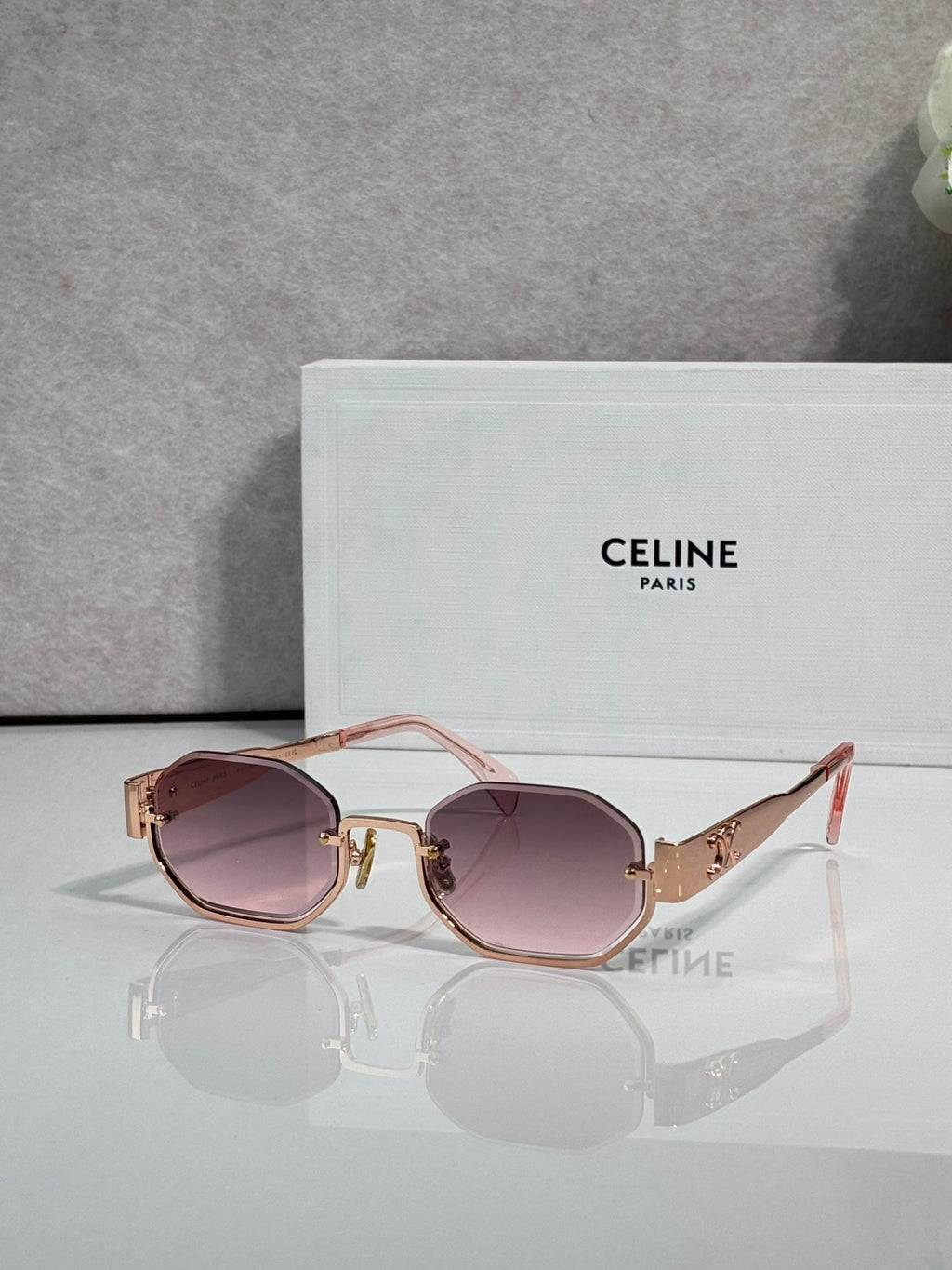 Celine glasses with gold-tone frame and rose-brown tinted lenses, red temple