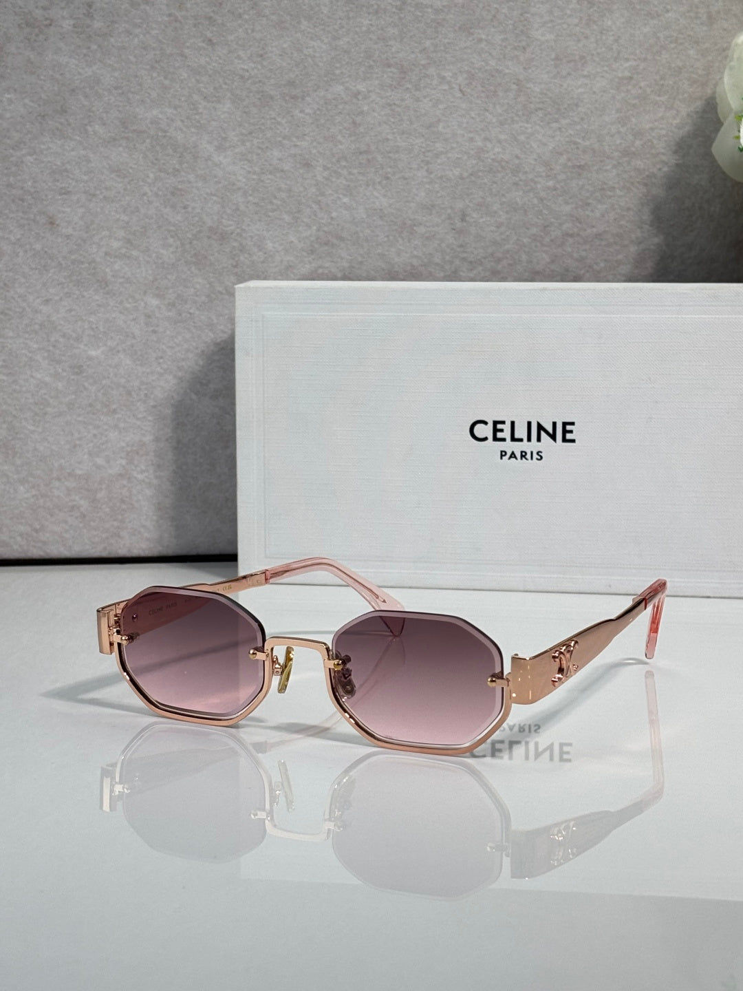 Celine glasses with gold-tone frame and rose-brown tinted lenses, red temple