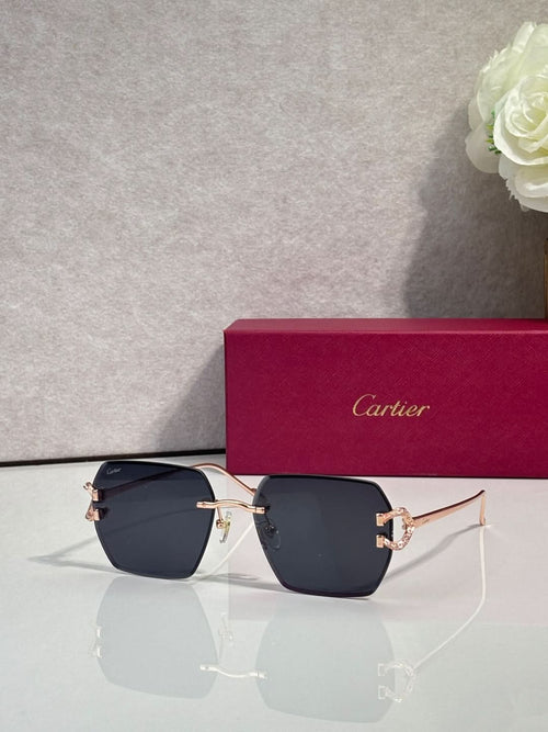 Cartier glasses with dark blue gradient lenses and gold-tone cat-eye frame