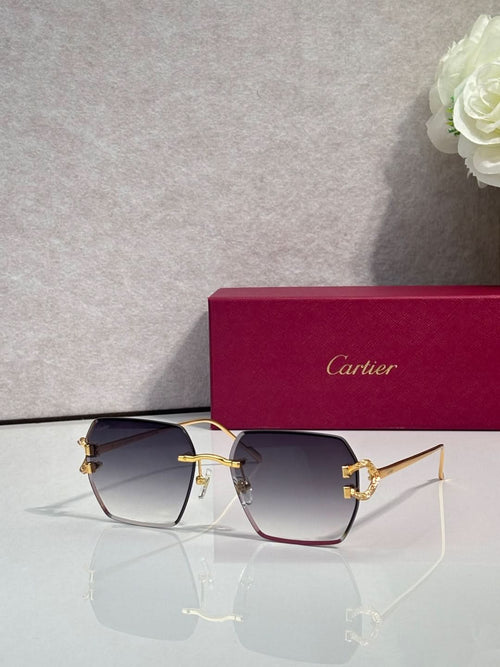 Cartier glasses with dark blue gradient lenses and gold-tone cat-eye frame