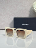 Chanel square sunglasses with light cream frame and gold logo detail on temple