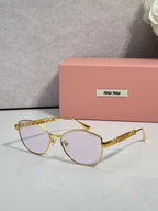 MiuMiu sunglasses, gold frame with clear tinted lenses