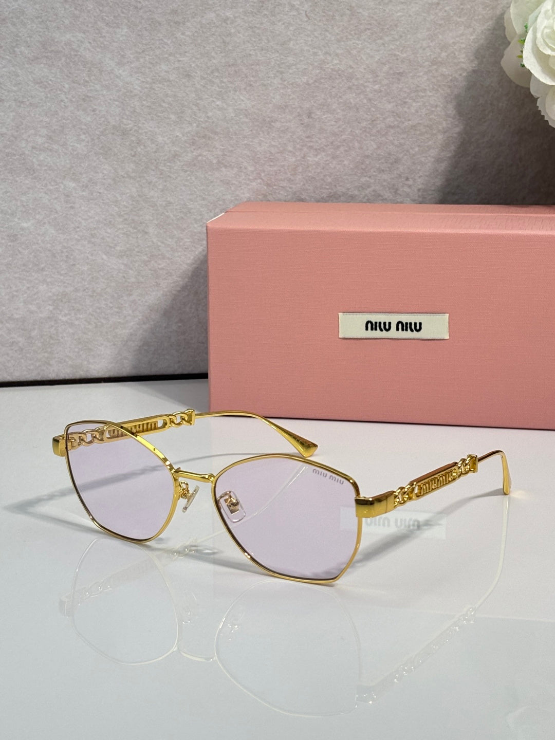 MiuMiu sunglasses, gold frame with clear tinted lenses