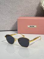 MiuMiu sunglasses, gold frame with dark round-oval lenses