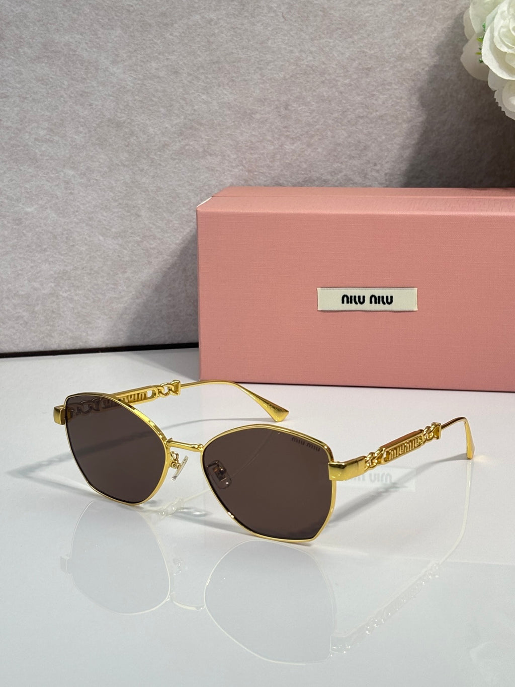 MiuMiu sunglasses, gold frame with dark oval lenses