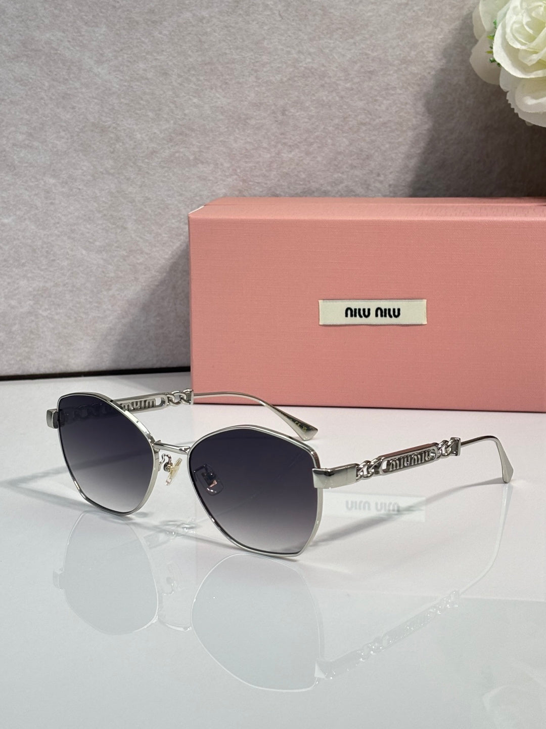 MiuMiu sunglasses, silver frame with dark lenses