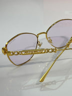 MiuMiu sunglasses, gold round-oval frames with engraved bridge