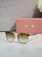 MiuMiu glasses with gold frame and cream tinted lenses