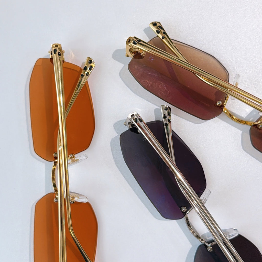 Cartier gold-tone sunglasses with side view; amber, dark, and rose lenses