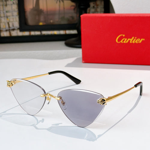 Gold-tone cat-eye glasses with clear lenses, dark arms, and small emblem hinges