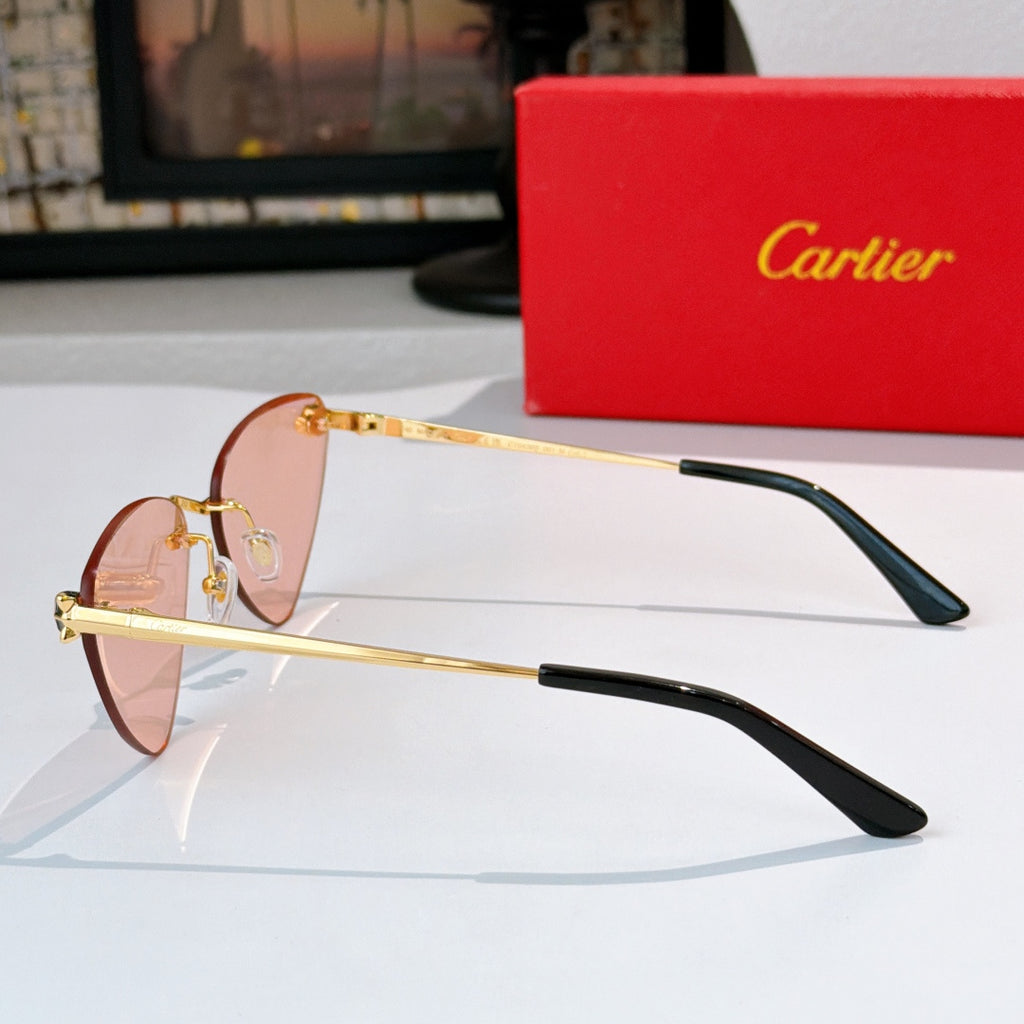 Gold-tone cat-eye glasses with pink-tinted lenses and black temple tips