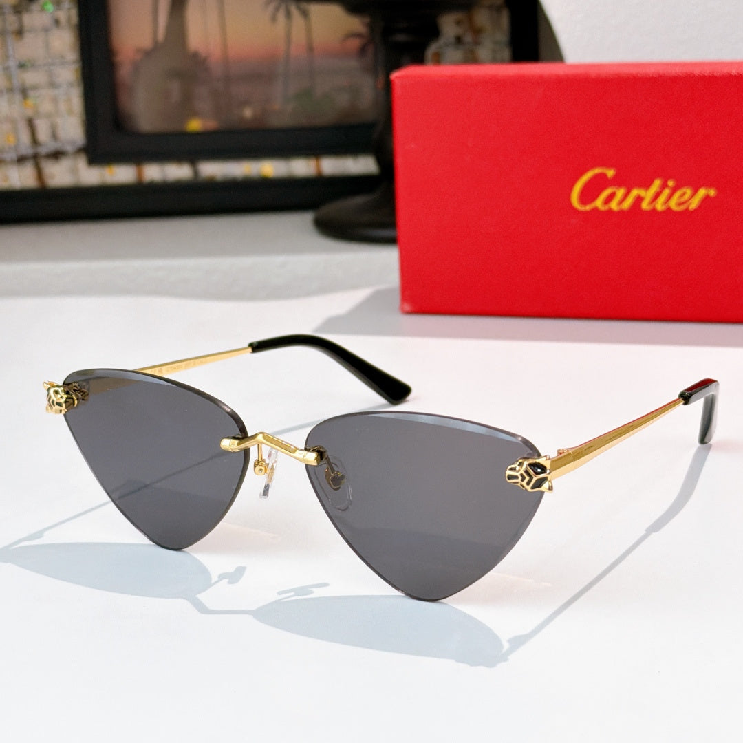 Gold-tone cat-eye glasses with dark gray tinted lenses and black temple tips