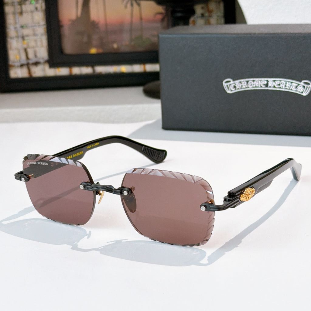 Gold-tone round sunglasses with brown-lavender gradient lenses and black temples