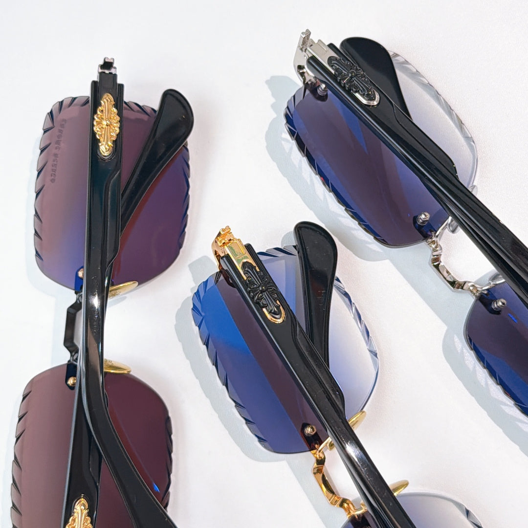 Sunglasses set with black frames, gold details, and dark tinted lenses