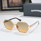 Octagonal sunglasses with gold frame, amber-tinted lenses, and black temples