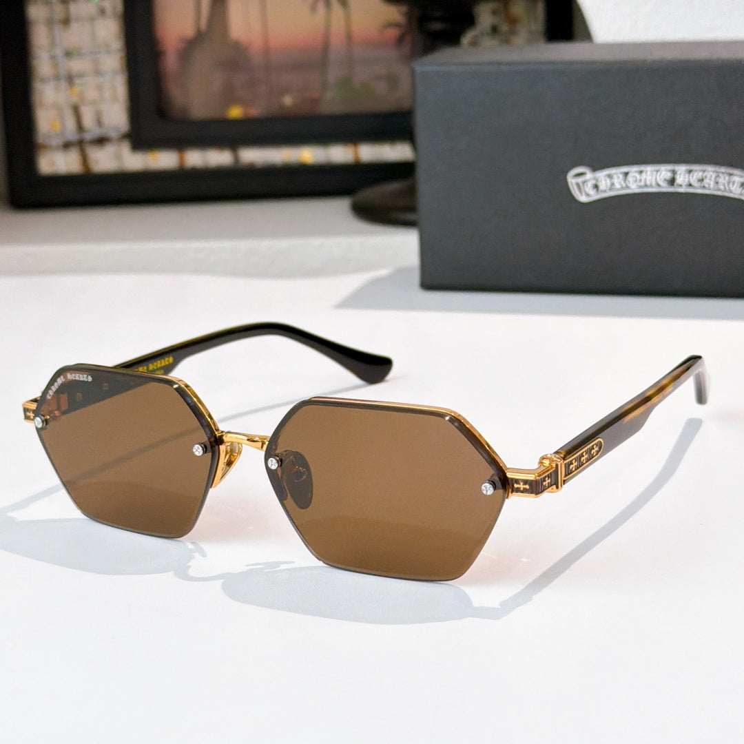 Gold sunglasses with brown hexagonal lenses and black temple tips