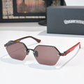 Black and red sunglasses with dark brown hexagonal lenses and metal hinges