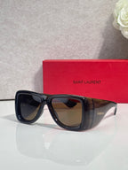 Dark tortoiseshell sunglasses with gradient lenses and glossy thick frame temples