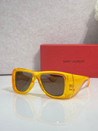 Yellow square sunglasses with tinted lenses and clear side arms, Saint Laurent
