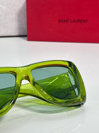 Green tinted sunglasses side view with curved clear frame, Saint Laurent