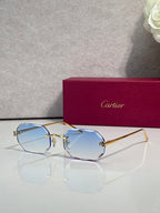 Gold-tone octagon eyeglasses with pale blue tint lenses