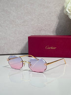 Gold-tone octagon eyeglasses with pink tint lenses
