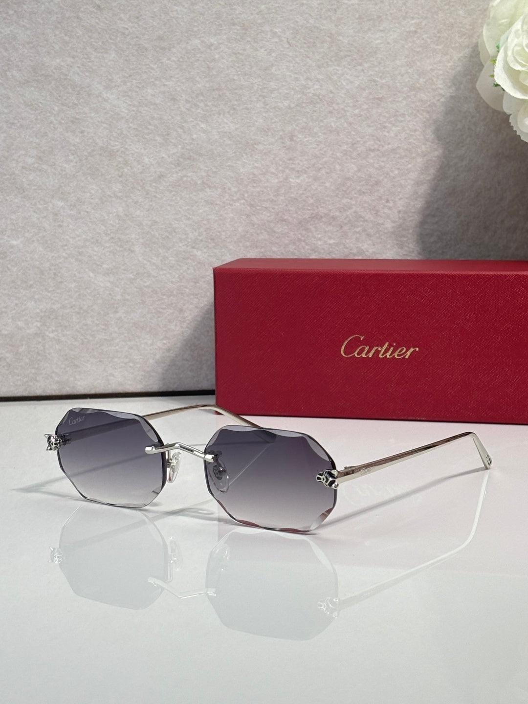 Gold-tone octagon eyeglasses with dark blue tint lenses