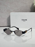 Celine sunglasses with dark lenses, black frame, and gold-tone temples.
