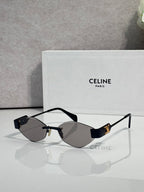 Celine sunglasses with dark lenses, black frame, and gold-tone temples.