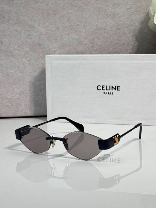 Celine sunglasses with dark lenses, black frame, and gold-tone temples.