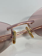 Celine sunglasses closeup: rose-gold front bar and gold-tone temple hinge.