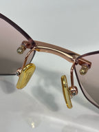 Celine sunglasses closeup: rose-gold hinges with gold-tone temple tips.