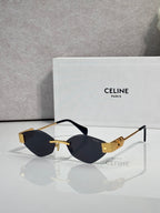 Celine sunglasses with dark lenses, black frame, and gold-tone detailing.