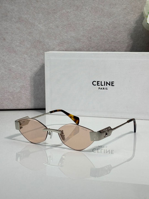 Celine sunglasses with brown-tinted lenses, tan frame, and gold-tone temples.
