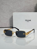 Gold-tone rectangular sunglasses, dark blue lenses, black temple accents