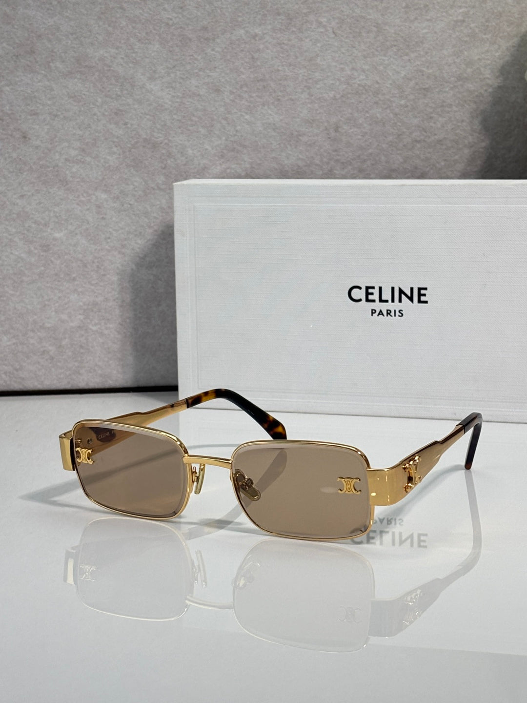 Gold-tone rectangular sunglasses, brown lenses, tortoiseshell temple arms