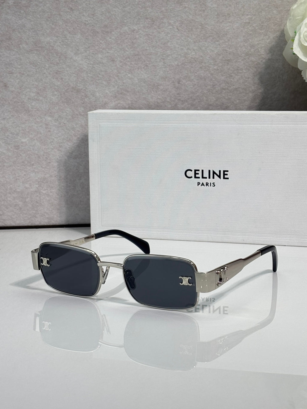 Gold-tone rectangular sunglasses, dark lenses, tortoiseshell temple arms