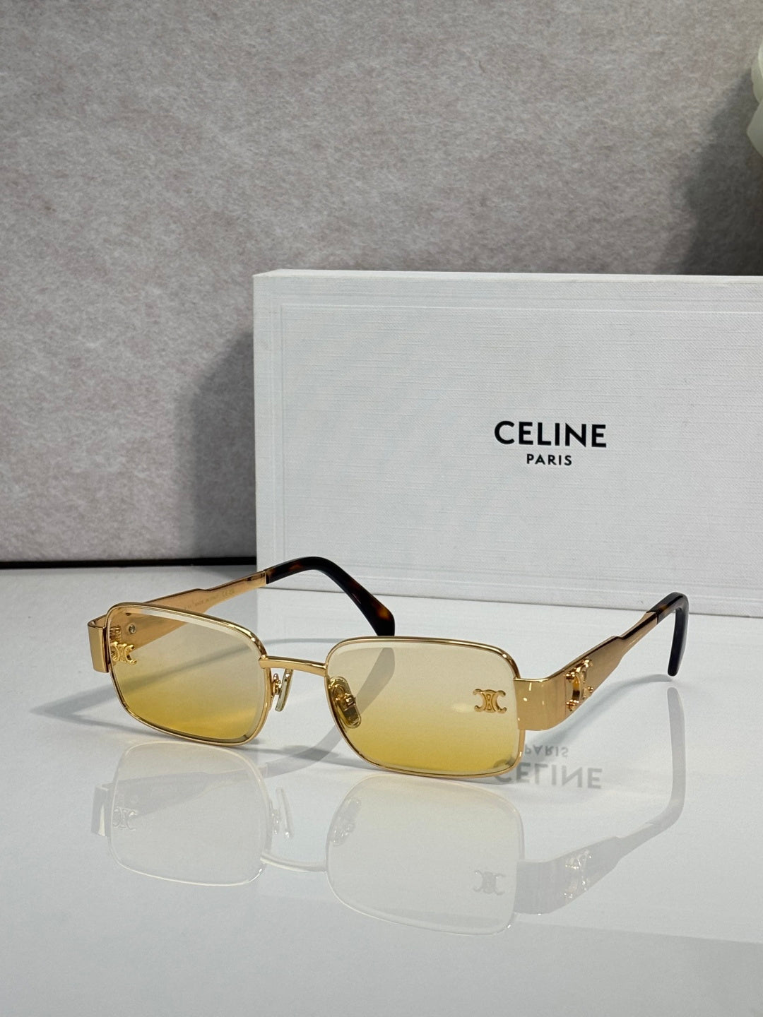 Gold-tone rectangular sunglasses, amber lenses, tortoiseshell temple arms