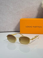 Louis Vuitton sunglasses with gold frames and amber-tinted lenses, ornate temple detail