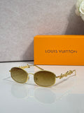 Louis Vuitton round glasses with gold frame and amber-tinted lenses