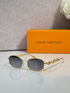 Louis Vuitton round glasses with gold frame and dark gray-tinted lenses