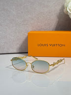 Louis Vuitton round glasses with gold frame and light green-tinted lenses